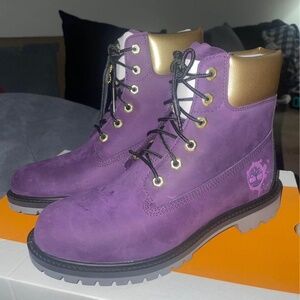 Purple and god timberlands